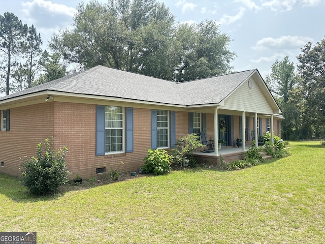 895 Ga Highway 57, Kite, GA 31049 - view of front of house featuring covered porch, crawl space, a front yard, and brick siding