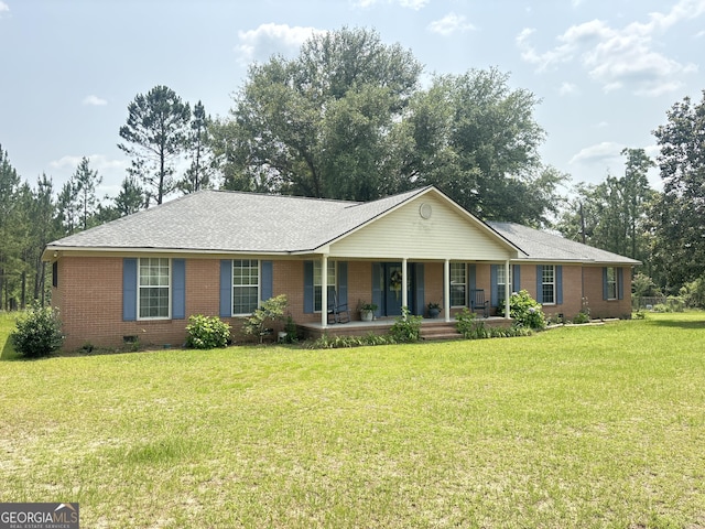 895 Ga Highway 57, Kite, GA 31049 - ranch-style home with covered porch, brick siding, crawl space, a front lawn, and a shingled roof