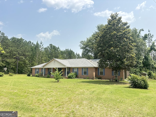 895 Ga Highway 57, Kite, GA 31049 - ranch-style house featuring a front yard, a porch, and brick siding