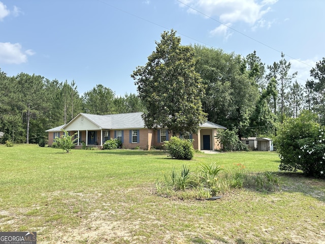 895 Ga Highway 57, Kite, GA 31049 - ranch-style home featuring a porch and a front lawn