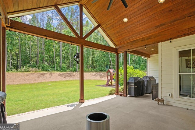 177 Garnett Point Dr, Carrollton, GA 30117 - view of patio with area for grilling, a ceiling fan, and a forest view