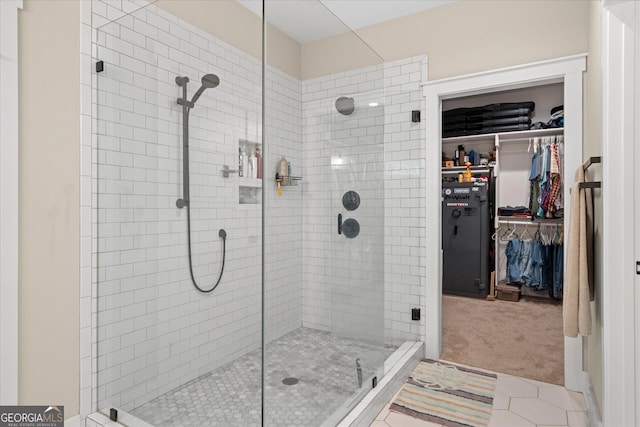 177 Garnett Point Dr, Carrollton, GA 30117 - bathroom with a shower stall and a walk in closet