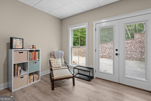 177 Garnett Point Dr, Carrollton, GA 30117 - living area featuring light wood-style flooring, a drop ceiling, and french doors