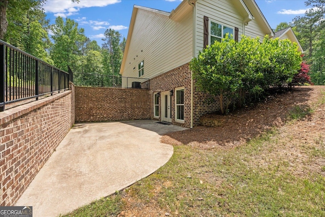 177 Garnett Point Dr, Carrollton, GA 30117 - view of side of property featuring brick siding and a patio