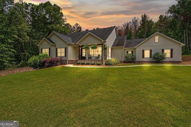 177 Garnett Point Dr, Carrollton, GA 30117 - view of front of home with covered porch and a yard