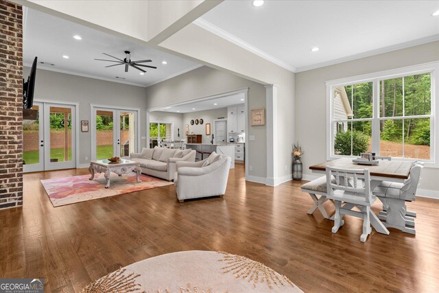 177 Garnett Point Dr, Carrollton, GA 30117 - living room featuring wood finished floors, plenty of natural light, recessed lighting, french doors, and ornamental molding