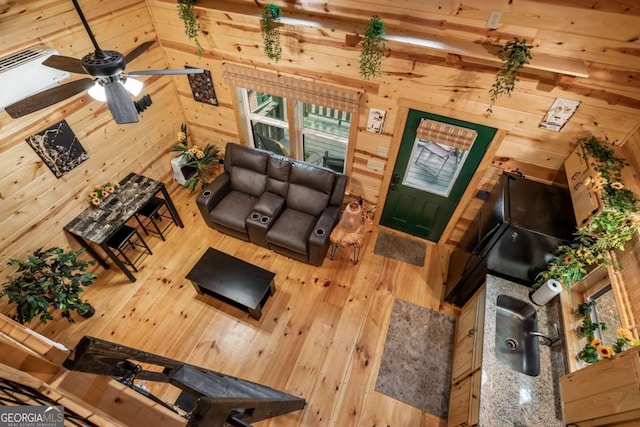 151 Rushmore Ln, Murphy, NC 28906 - living room with wood walls, wood-type flooring, and a ceiling fan