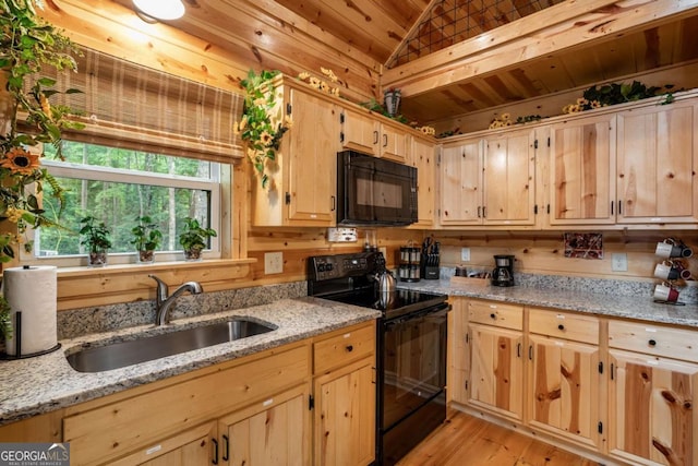 151 Rushmore Ln, Murphy, NC 28906 - kitchen featuring black appliances, light brown cabinetry, lofted ceiling, light wood-style floors, and wooden ceiling