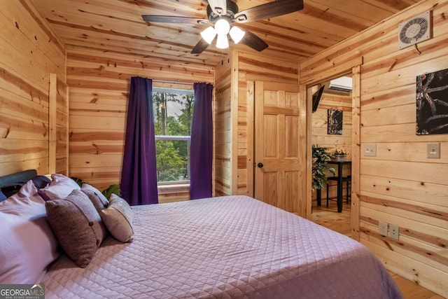 151 Rushmore Ln, Murphy, NC 28906 - bedroom with wooden walls, wood ceiling, wood finished floors, and an AC wall unit