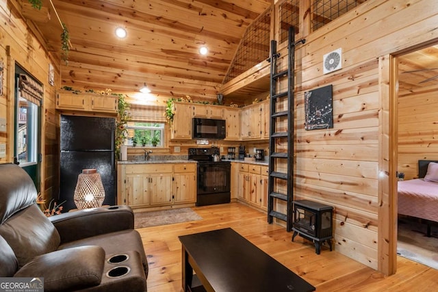 151 Rushmore Ln, Murphy, NC 28906 - living room featuring wood ceiling, wooden walls, light wood-type flooring, and lofted ceiling