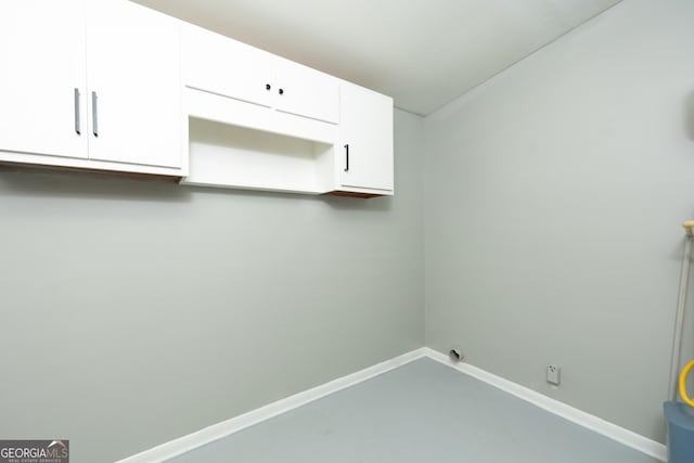3027 Lansing Ave, Columbus, GA 31907 - laundry room with baseboards and cabinet space