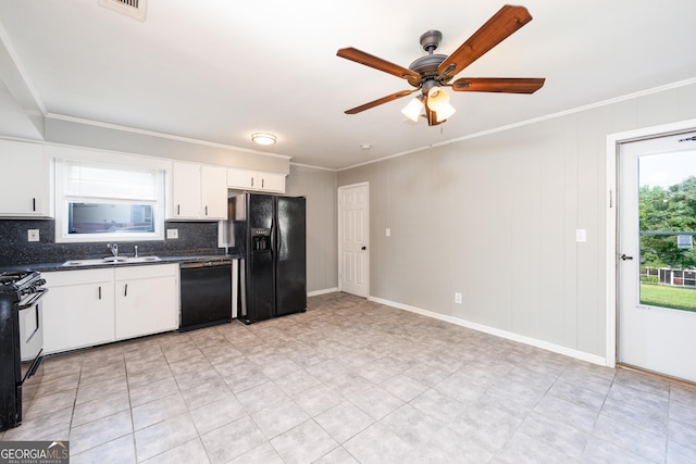 3027 Lansing Ave, Columbus, GA 31907 - kitchen featuring black appliances, dark countertops, healthy amount of natural light, tasteful backsplash, and crown molding