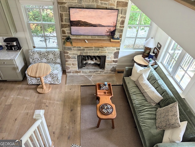 10540 Serenbe Ln, Chattahoochee Hills, GA 30268 - living area featuring hardwood / wood-style floors and a fireplace