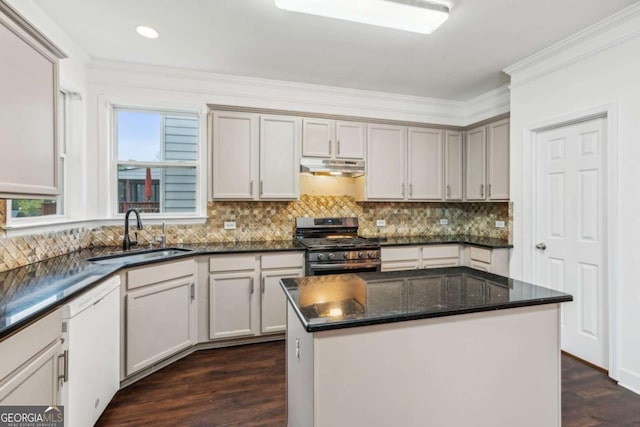 2539 Larson Creek Cv, Duluth, GA 30097 - kitchen with stainless steel range with gas stovetop, under cabinet range hood, white dishwasher, crown molding, and tasteful backsplash