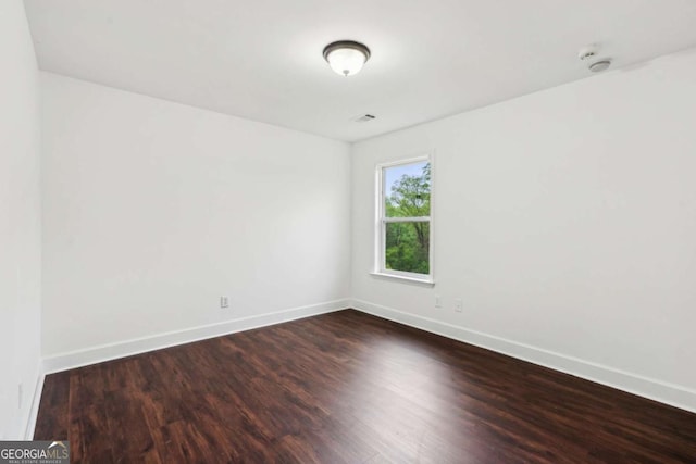 2539 Larson Creek Cv, Duluth, GA 30097 - unfurnished room featuring baseboards and dark wood-style floors