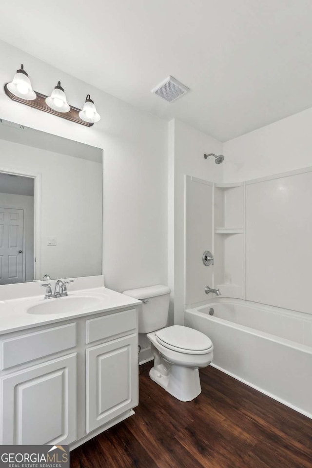 2539 Larson Creek Cv, Duluth, GA 30097 - bathroom featuring vanity, wood finished floors, and bathing tub / shower combination