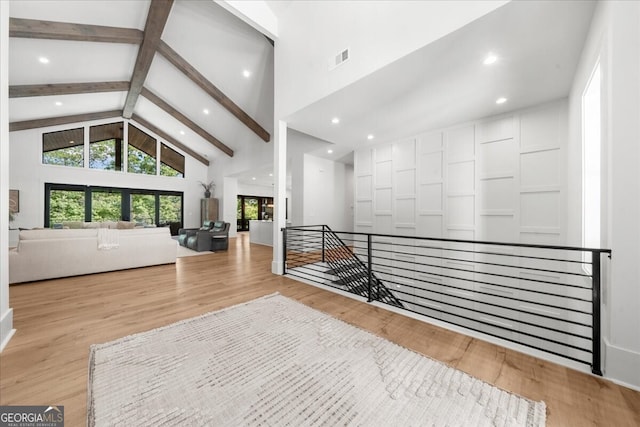 4451 Shellie Ln, Oakwood, GA 30566 - corridor with an upstairs landing, plenty of natural light, high vaulted ceiling, wood finished floors, and beam ceiling