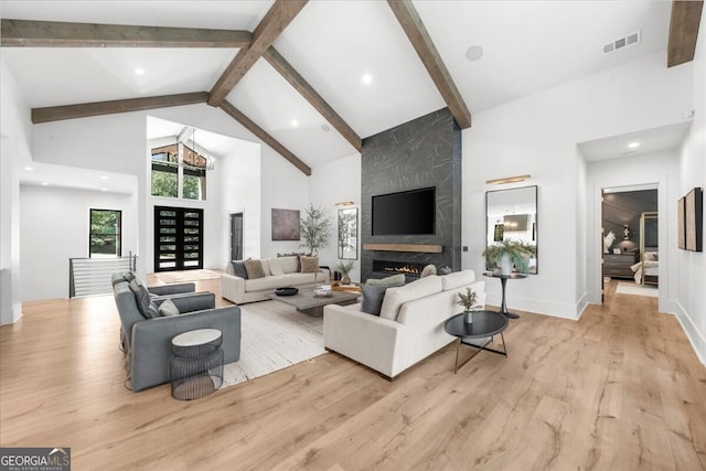 4451 Shellie Ln, Oakwood, GA 30566 - living area featuring high vaulted ceiling, light wood finished floors, beam ceiling, a fireplace, and recessed lighting