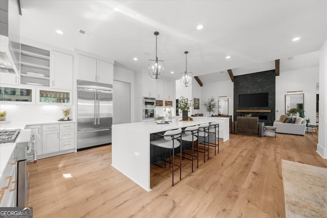 4451 Shellie Ln, Oakwood, GA 30566 - kitchen with appliances with stainless steel finishes, white cabinetry, light wood-style floors, light countertops, and recessed lighting