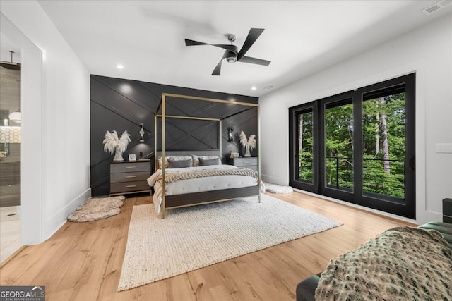 4451 Shellie Ln, Oakwood, GA 30566 - bedroom featuring wood finished floors, an accent wall, ceiling fan, a decorative wall, and recessed lighting