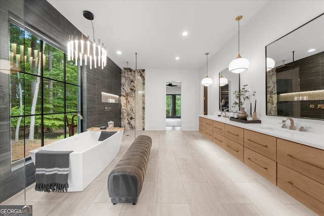 4451 Shellie Ln, Oakwood, GA 30566 - full bath featuring a walk in shower, double vanity, a freestanding bath, tile patterned flooring, and recessed lighting