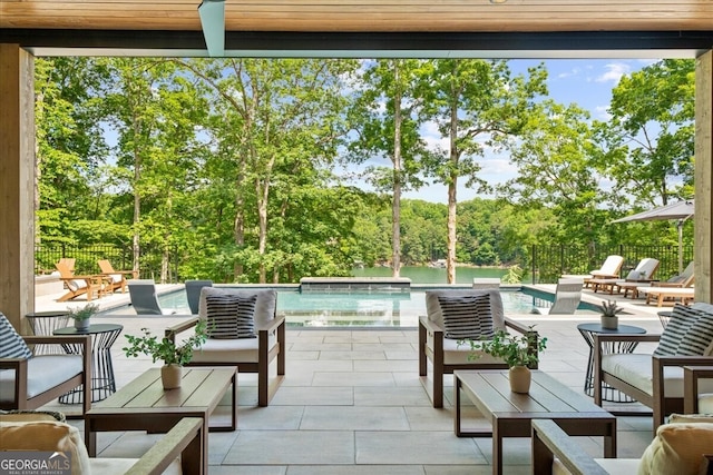 4451 Shellie Ln, Oakwood, GA 30566 - view of patio with an outdoor living space and view of wooded area