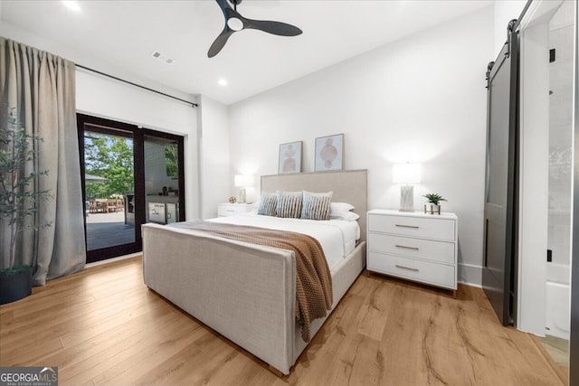 4451 Shellie Ln, Oakwood, GA 30566 - bedroom with a barn door, access to exterior, light wood-style flooring, recessed lighting, and a ceiling fan