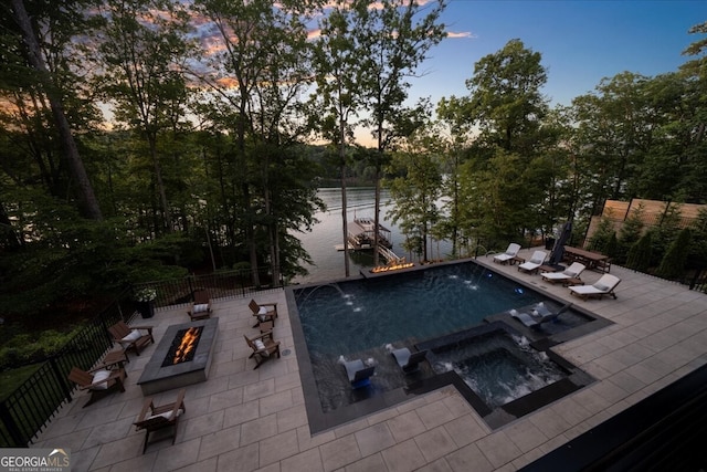 4451 Shellie Ln, Oakwood, GA 30566 - view of swimming pool with an outdoor fire pit, a patio, a water view, and a pool with connected hot tub