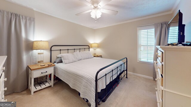 241 Lavern Ct, Winder, GA 30680 - bedroom with light carpet, crown molding, and a ceiling fan