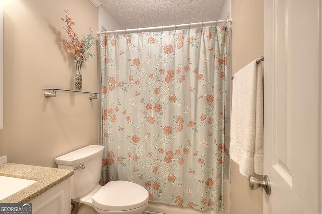 241 Lavern Ct, Winder, GA 30680 - bathroom with double vanity, ornamental molding, and a textured ceiling