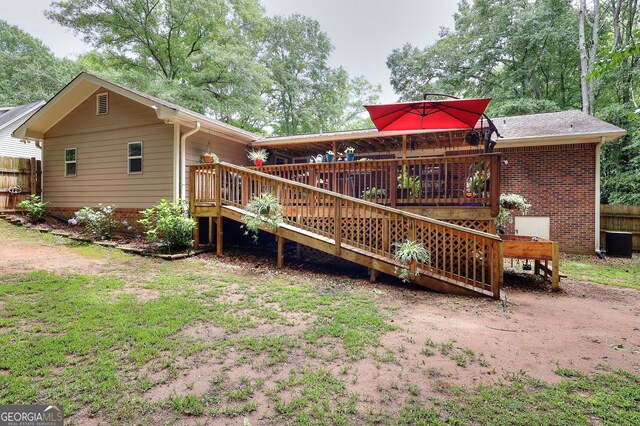 241 Lavern Ct, Winder, GA 30680 - back of house featuring a wooden deck and brick siding