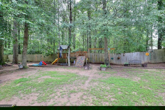 241 Lavern Ct, Winder, GA 30680 - living room with light colored carpet, a fireplace, a ceiling fan, and healthy amount of natural light