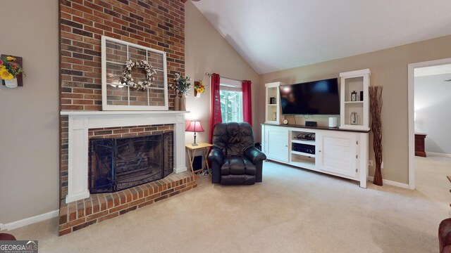 241 Lavern Ct, Winder, GA 30680 - living area featuring a brick fireplace, carpet flooring, and vaulted ceiling