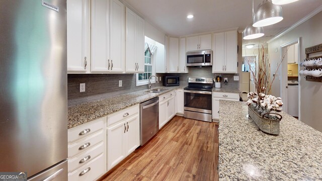 241 Lavern Ct, Winder, GA 30680 - carpeted bedroom with multiple windows, crown molding, a textured ceiling, and a crib