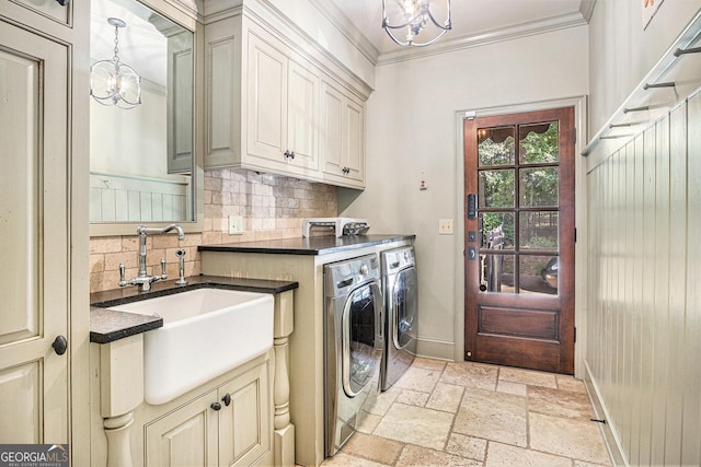 1155 Admiral Xing, Alpharetta, GA 30005 - laundry area featuring a chandelier, separate washer and dryer, cabinet space, stone tile flooring, and ornamental molding