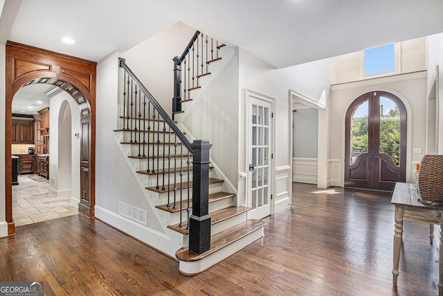 1155 Admiral Xing, Alpharetta, GA 30005 - foyer entrance with french doors, arched walkways, stairs, wood finished floors, and recessed lighting