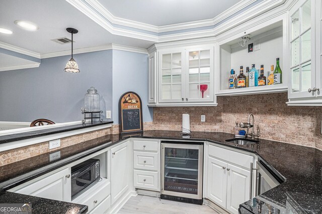 1155 Admiral Xing, Alpharetta, GA 30005 - indoor bar with wine cooler, ornamental molding, backsplash, pendant lighting, and light wood finished floors