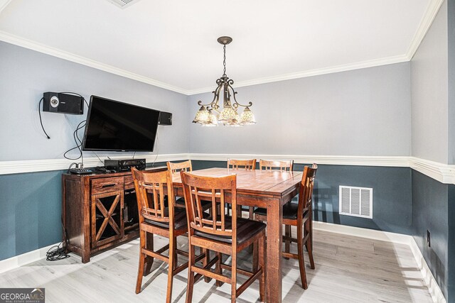 1155 Admiral Xing, Alpharetta, GA 30005 - dining room with light wood-style floors, ornamental molding, and a chandelier