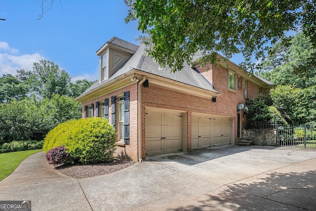 1155 Admiral Xing, Alpharetta, GA 30005 - view of side of property featuring brick siding, driveway, roof with shingles, and an attached garage