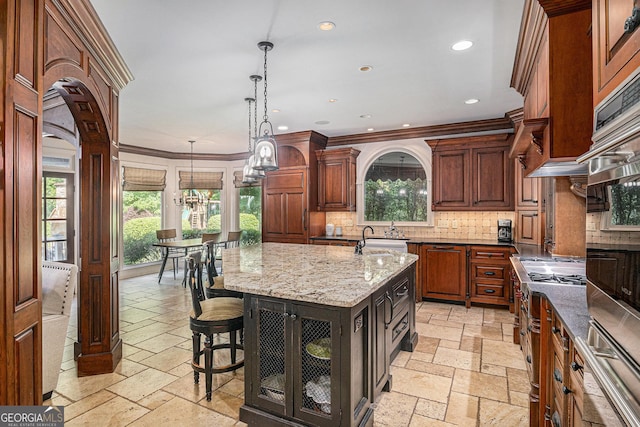 1155 Admiral Xing, Alpharetta, GA 30005 - kitchen with stone tile flooring, decorative backsplash, light stone counters, healthy amount of natural light, and recessed lighting
