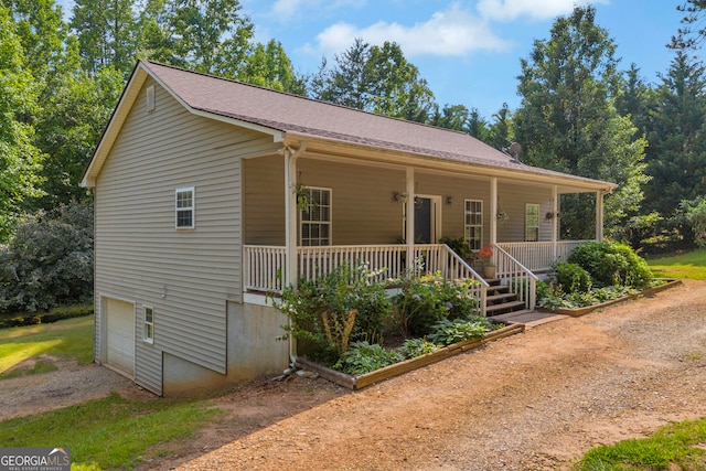 15 Bern Vis, Sautee Nacoochee, GA 30571 - view of front of home featuring dirt driveway, a porch, and an attached garage