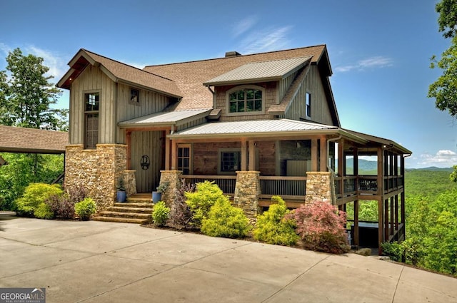 330 Serenity Ridge Ln, Mineral Bluff, GA 30559 - view of front facade featuring stone siding, covered porch, a standing seam roof, and board and batten siding