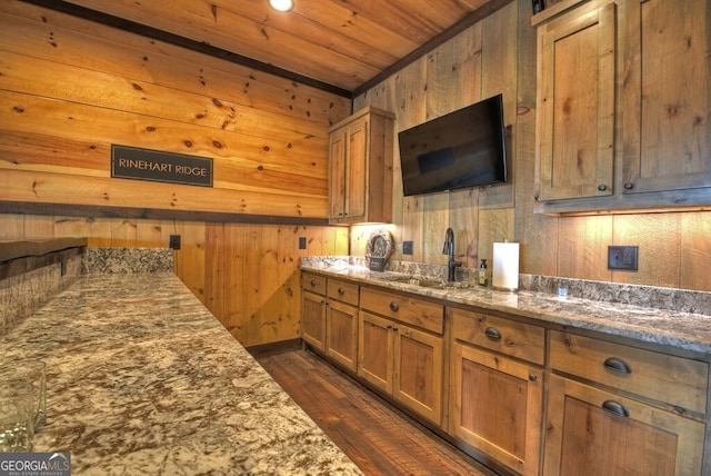 330 Serenity Ridge Ln, Mineral Bluff, GA 30559 - kitchen with dark wood-style floors, light stone countertops, wooden ceiling, wooden walls, and brown cabinets