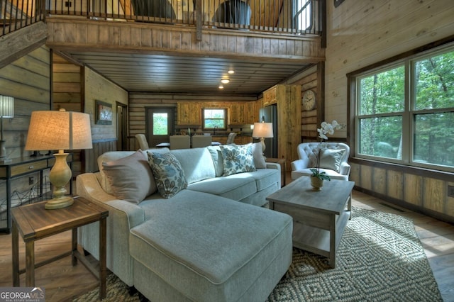 330 Serenity Ridge Ln, Mineral Bluff, GA 30559 - living area featuring wood finished floors, wooden walls, and a towering ceiling