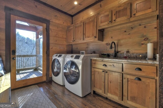 330 Serenity Ridge Ln, Mineral Bluff, GA 30559 - laundry area featuring cabinet space, washer and dryer, dark wood-style floors, wooden walls, and wood ceiling