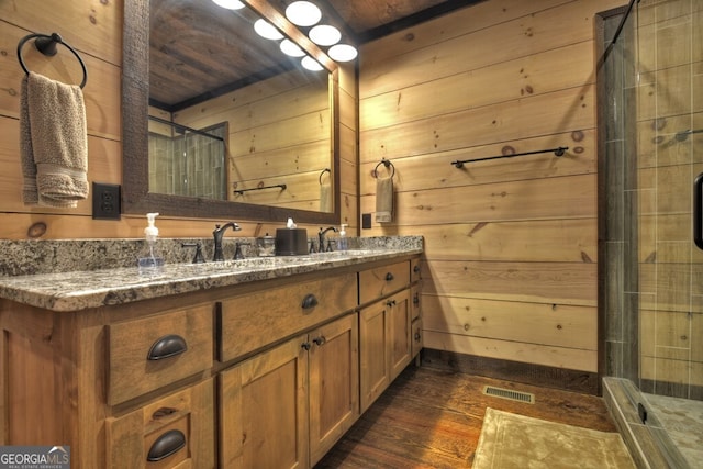 330 Serenity Ridge Ln, Mineral Bluff, GA 30559 - full bath featuring hardwood / wood-style flooring, double vanity, wood walls, and a shower stall