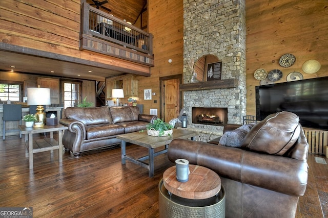 330 Serenity Ridge Ln, Mineral Bluff, GA 30559 - living room with a stone fireplace, a high ceiling, wood walls, and wood-type flooring