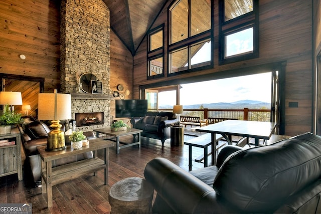 330 Serenity Ridge Ln, Mineral Bluff, GA 30559 - living area featuring high vaulted ceiling, wooden walls, hardwood / wood-style flooring, a fireplace, and a wood ceiling with exposed beams