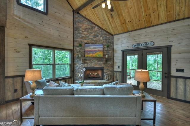 330 Serenity Ridge Ln, Mineral Bluff, GA 30559 - living area with a wooden ceiling with exposed beams, plenty of natural light, high vaulted ceiling, wooden walls, and hardwood / wood-style floors