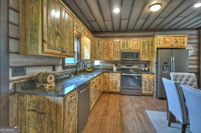 330 Serenity Ridge Ln, Mineral Bluff, GA 30559 - kitchen featuring stainless steel appliances, hardwood / wood-style floors, brown cabinetry, and dark stone counters